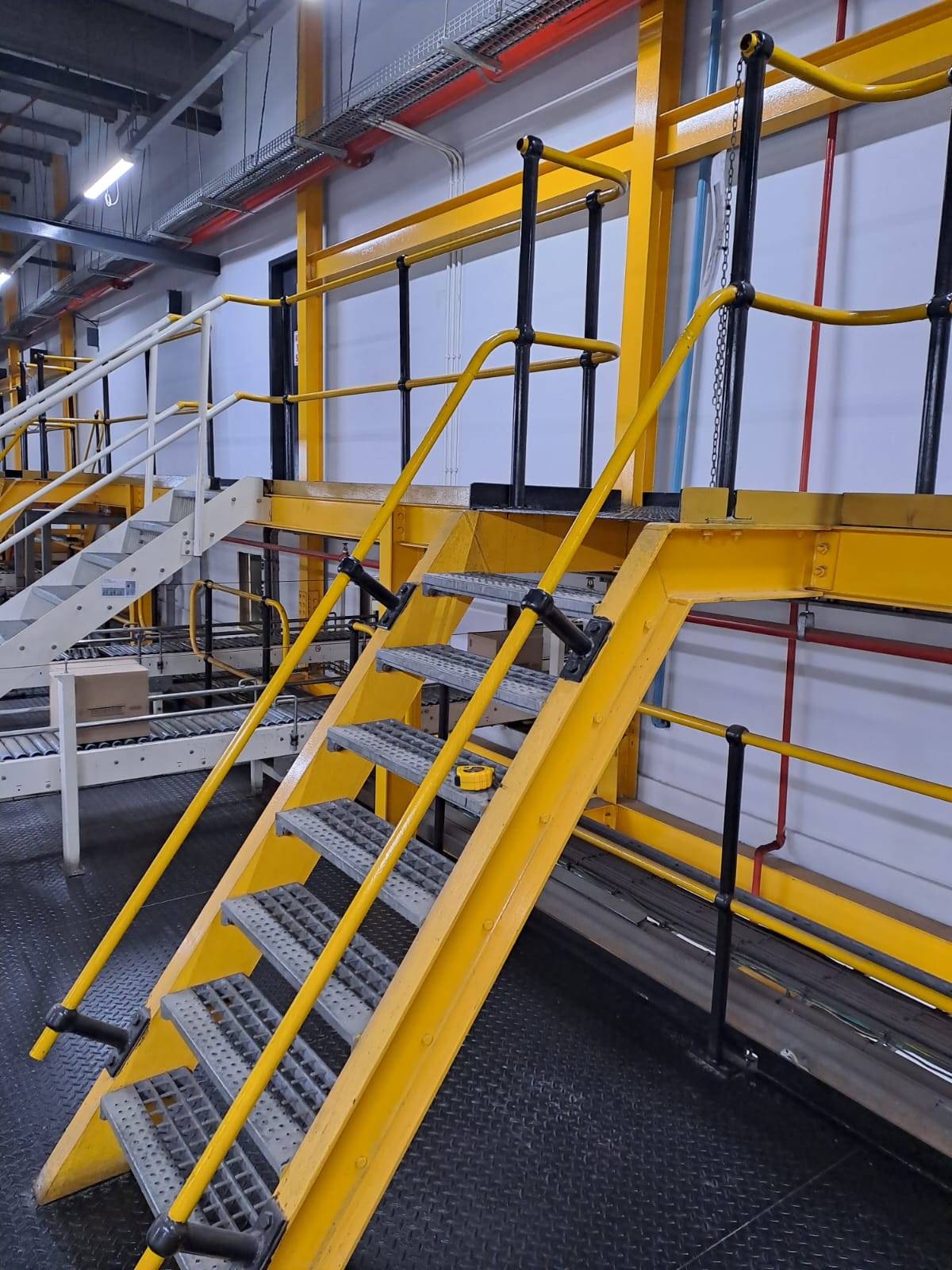Industrial access stairway with safety railings