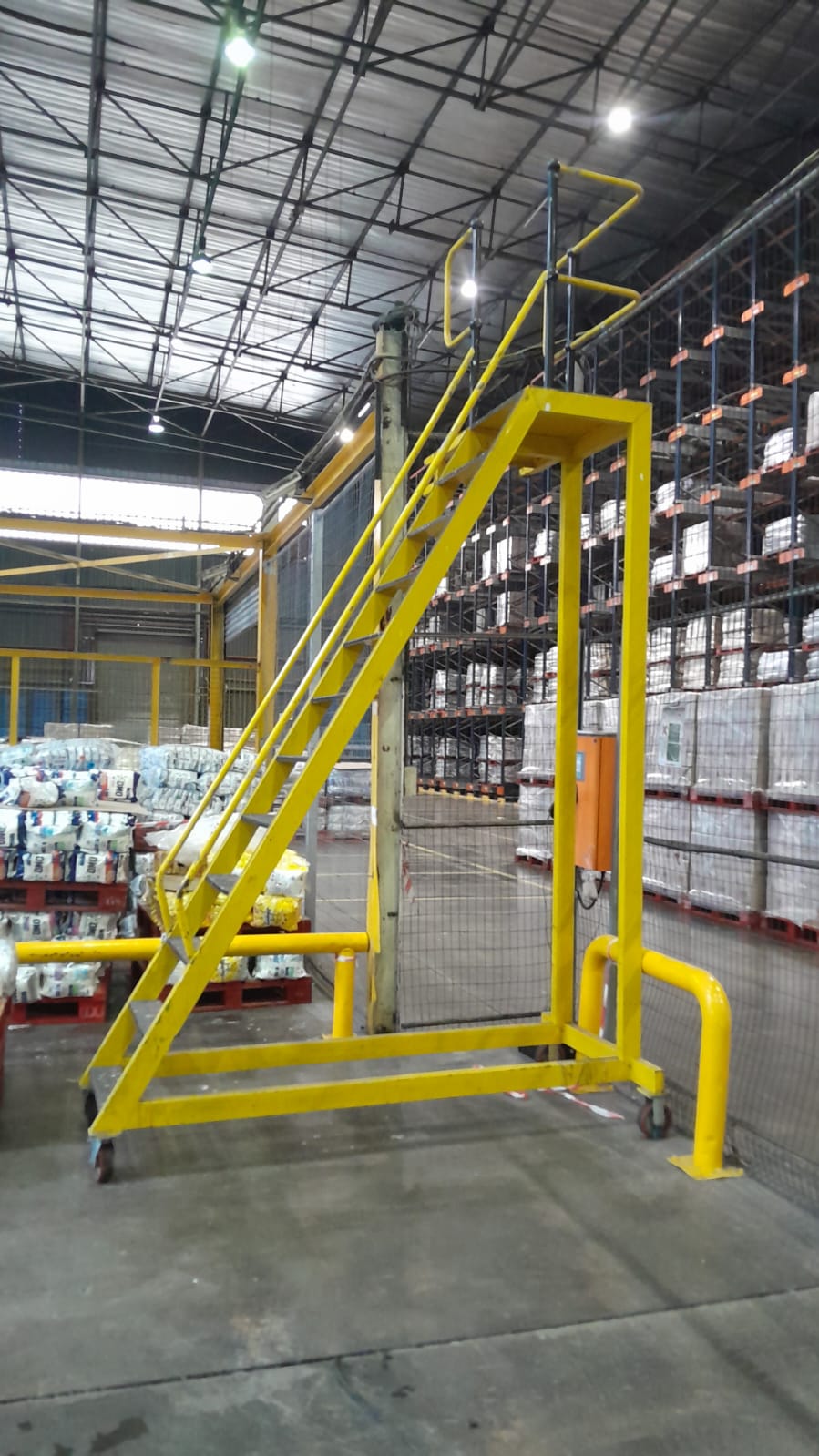 Mobile steel access stairway in warehouse