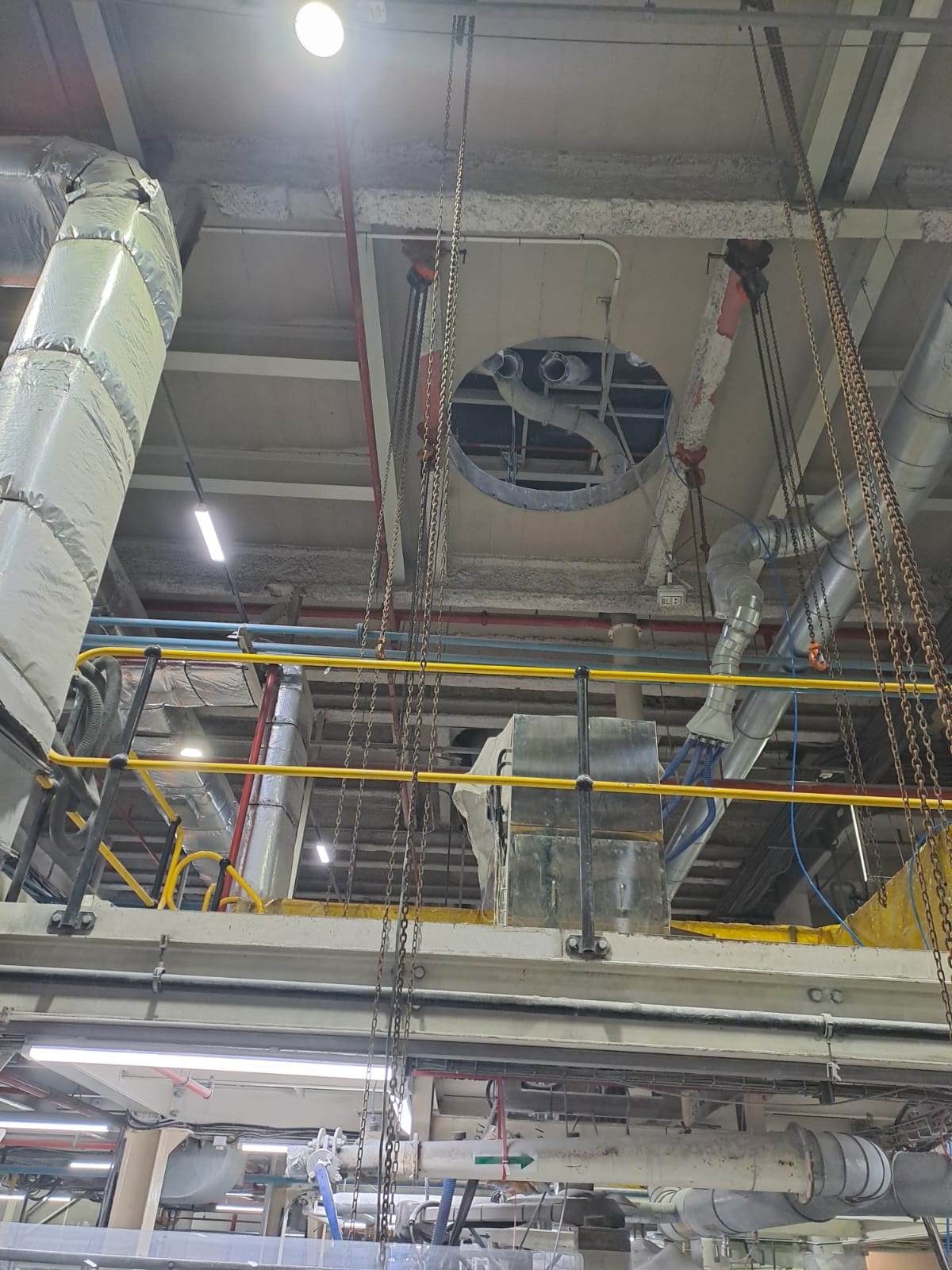 Chain hoists rigging equipment through floor opening